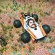 A screenshot from No Man's Sky showing Sean Murray's head modded on a car.